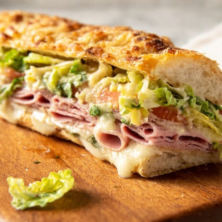 Focaccia Grinder Sandwich with Pesto, Salame, Capocollo, and Fresh Greens Recipe